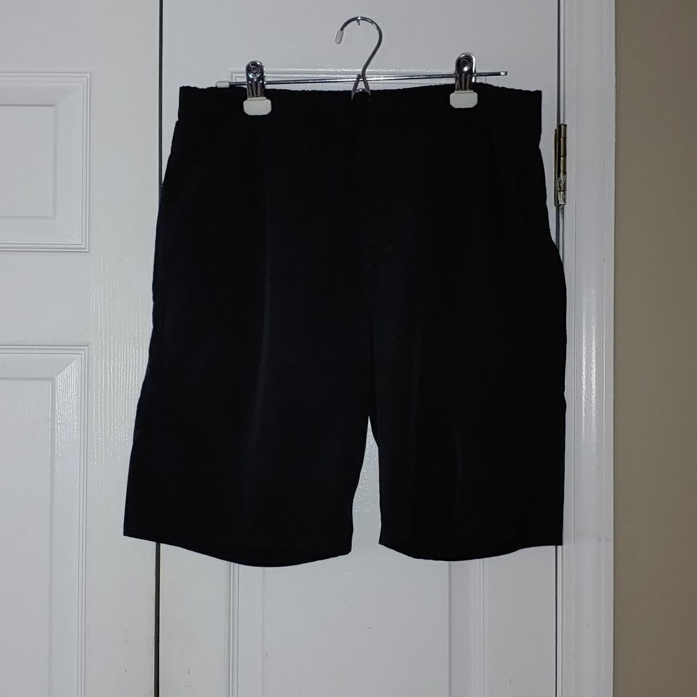 Hurley  black  hybrid pull on elastic shorts with pockets Sz L